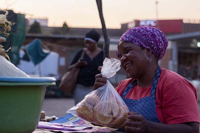 Community outreach event serving meals in a South African community