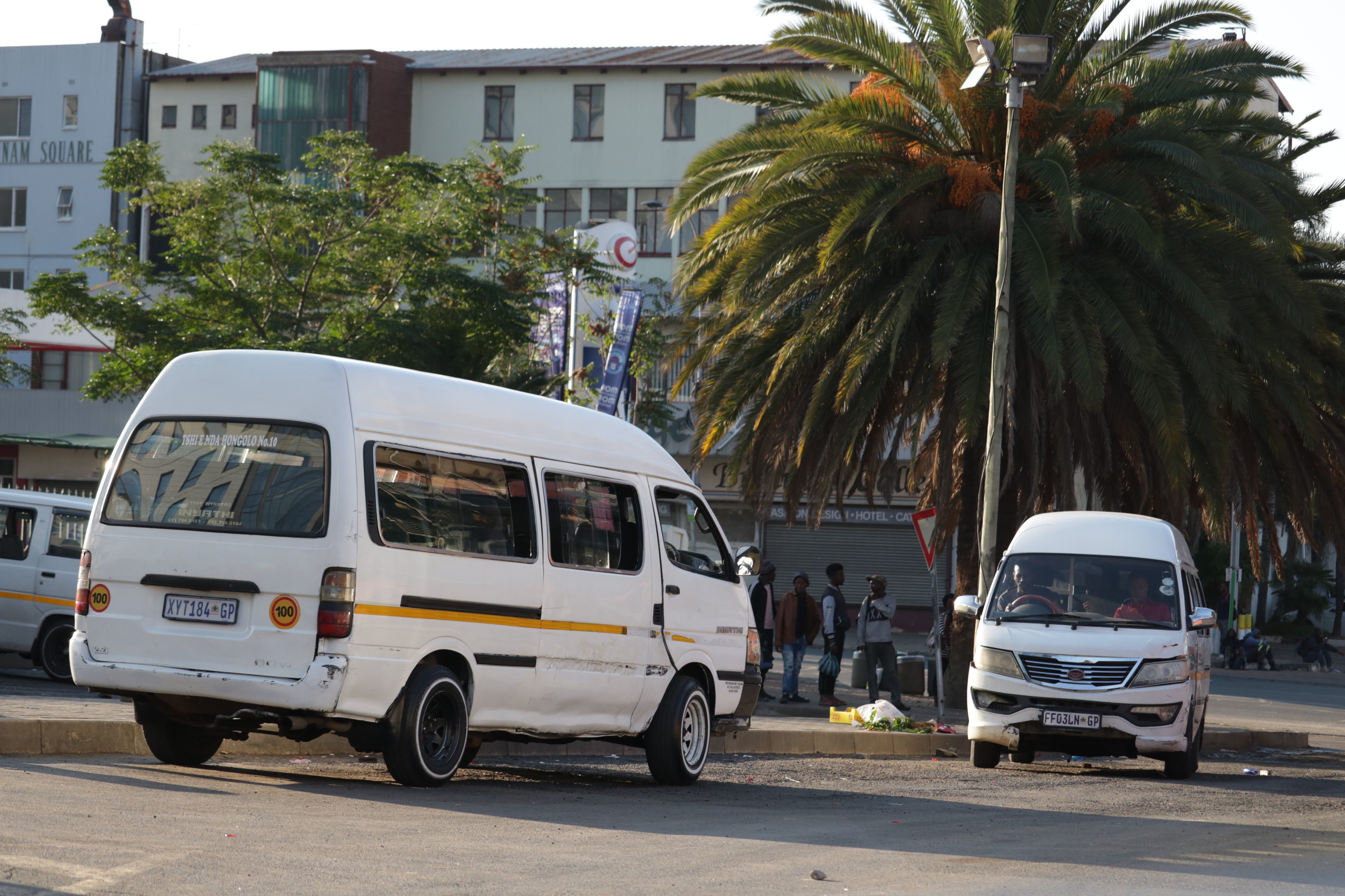 Fleet of white Toyota Quantum Sesfikile minibus taxis in South Africa