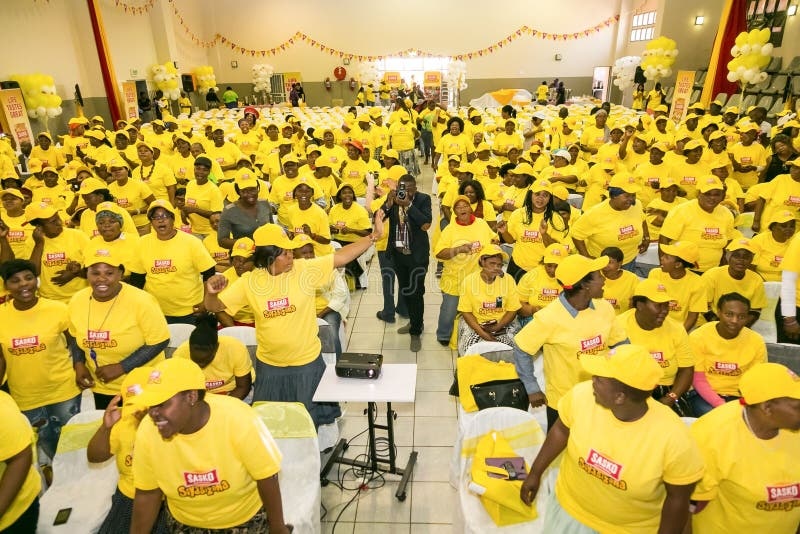 South African community members engaged in a town hall meeting in Johannesburg