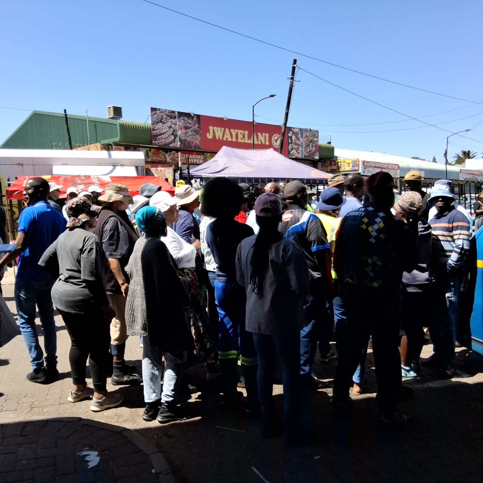 Community Members at Information Tent
