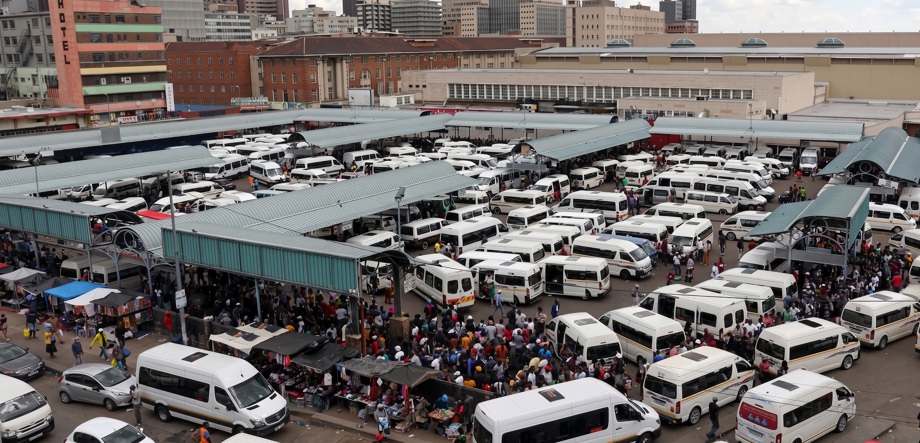 Minibus taxi rank in Pretoria Tshwane with white Toyota Quantum taxis